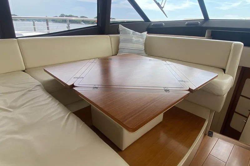 Slide: The Image of Luxurious interior of 2014 Azimut Magellano 50 yacht with elegant wooden table. - 16