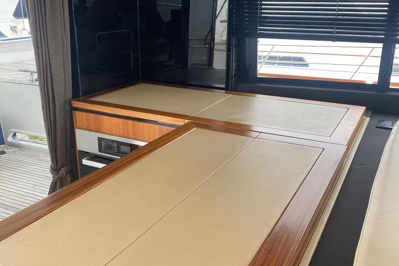 Slide: The Image of Interior of 2014 Azimut Magellano 50 yacht with elegant wood and leather finishes. - 17