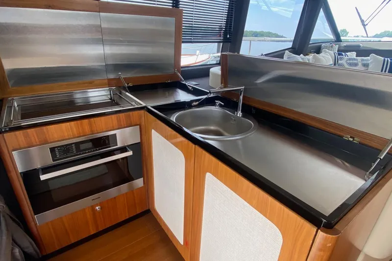 Slide: The Image of Modern kitchen area on 2014 Azimut Magellano 50 yacht with stainless steel appliances. - 19
