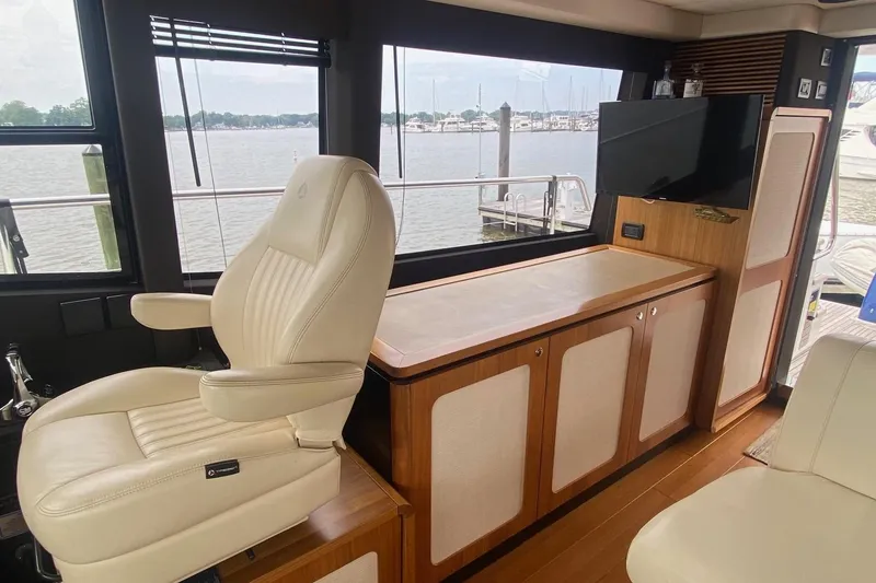 Slide: The Image of Luxurious interior of 2014 Azimut Magellano 50 yacht with leather seating and wood cabinetry. - 2