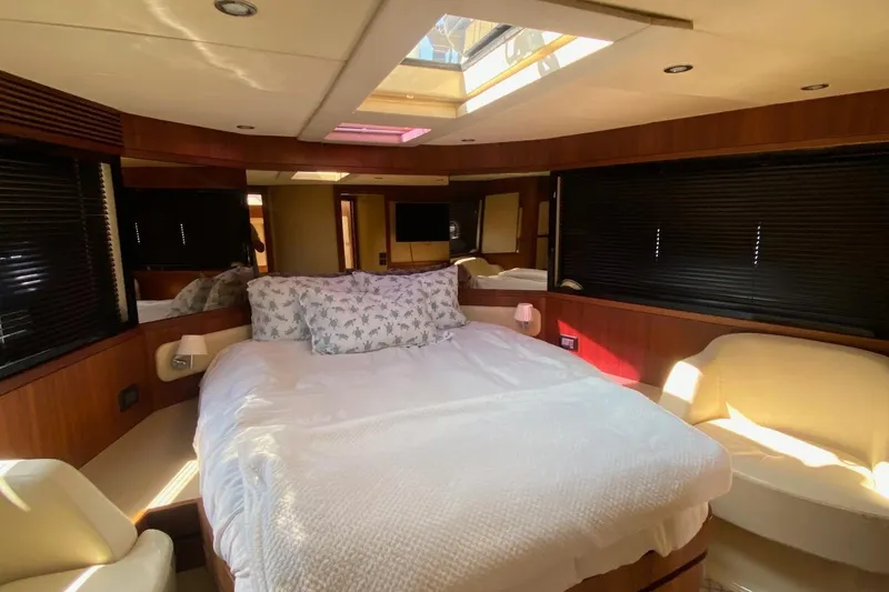 Slide: The Image of Luxurious bedroom interior of 2014 Azimut Magellano 50 yacht with elegant furnishings. - 25