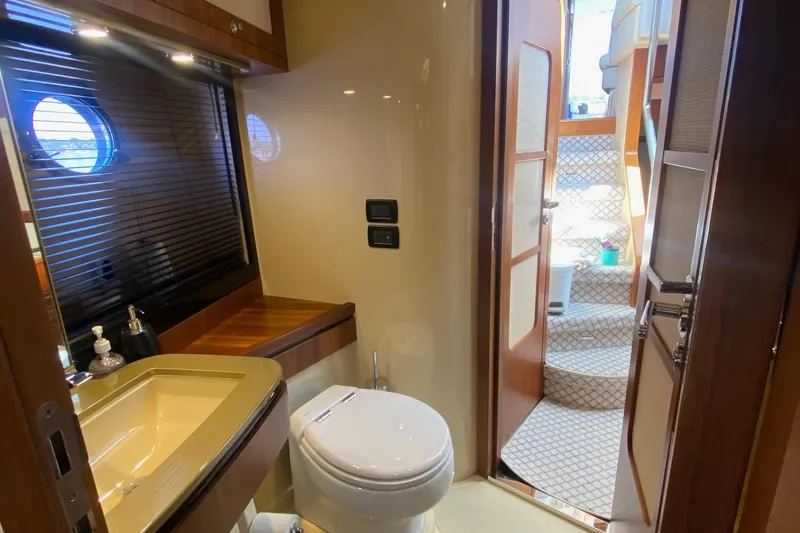 Slide: The Image of Luxurious bathroom on 2014 Azimut Magellano 50 yacht with modern fixtures and wooden accents. - 27