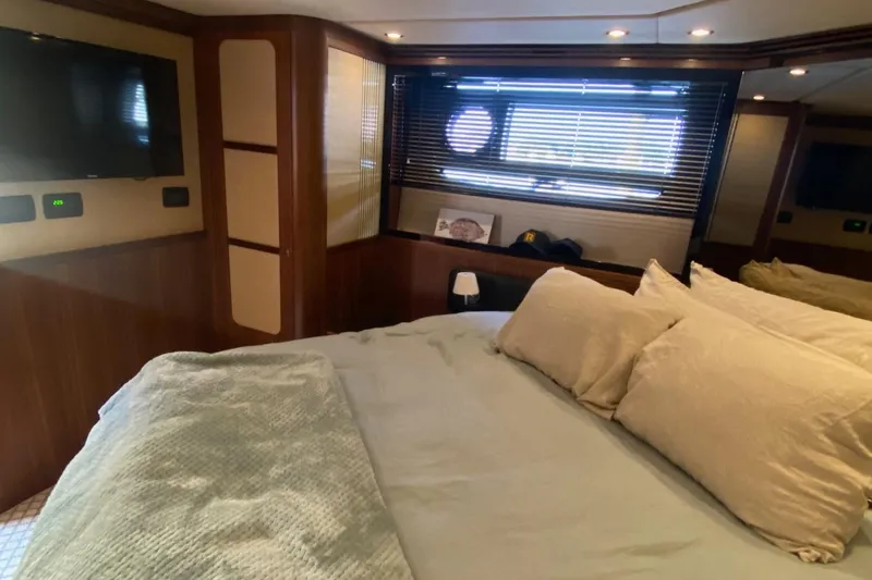 Slide: The Image of Luxurious bedroom interior of 2014 Azimut Magellano 50 yacht with cozy bedding and modern decor. - 32
