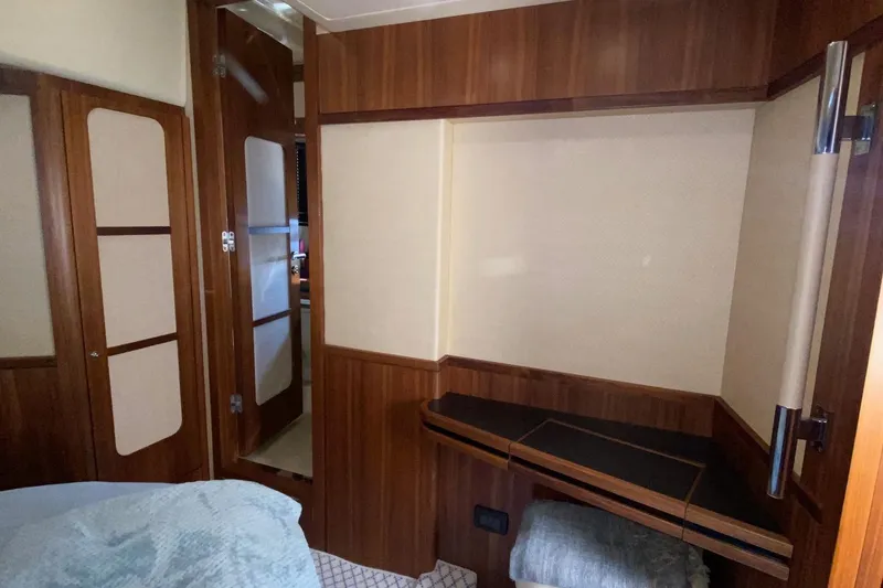 Slide: The Image of Interior of 2014 Azimut Magellano 50 yacht with wood paneling and cozy design. - 33