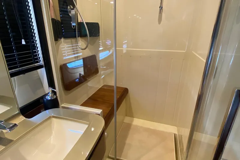 Slide: The Image of Luxurious bathroom in 2014 Azimut Magellano 50 yacht with modern fixtures and glass shower. - 36