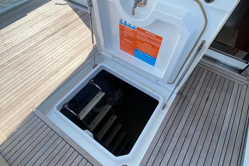 Slide: The Image of Open hatch on 2014 Azimut Magellano 50 yacht deck, revealing interior access. - 37