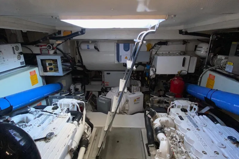 Slide: The Image of Engine room of 2014 Azimut Magellano 50 yacht, featuring dual engines and equipment. - 38
