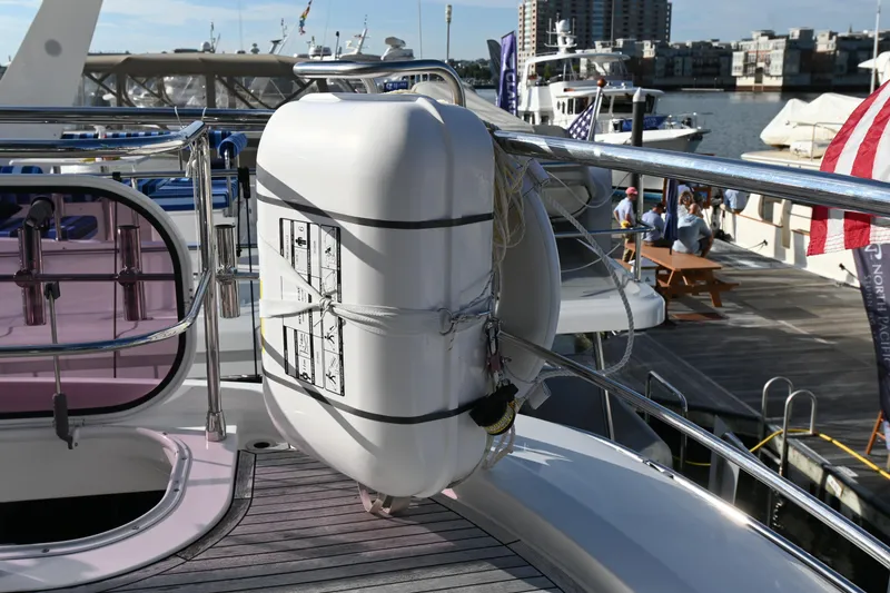 Slide: The Image of Azimut Magellano 50 yacht, 2014 model, featuring a life raft on deck at a marina. - 40