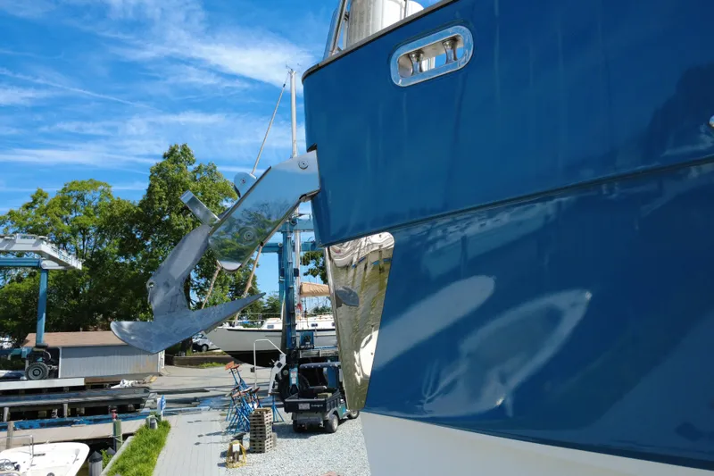 Slide: The Image of Azimut Magellano 50 yacht anchor detail, 2014 model, docked under clear blue sky. - 42
