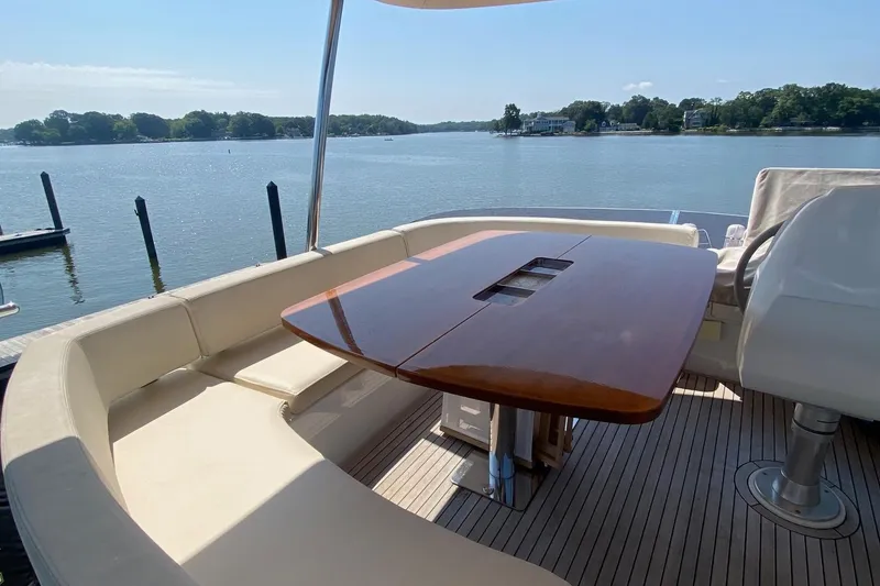 Slide: The Image of Luxurious seating area on 2014 Azimut Magellano 50 yacht with scenic water view. - 5