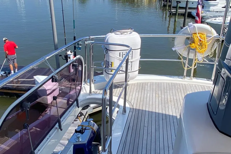 Slide: The Image of Azimut Magellano 50 yacht deck, 2014 model, docked with safety equipment visible. - 6