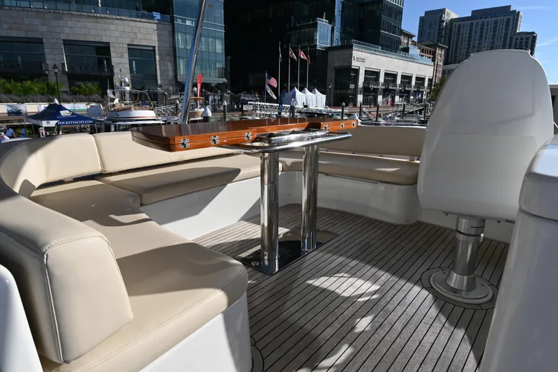 Slide: The Image of Luxurious seating area on 2014 Azimut Magellano 50 yacht, docked in urban marina. - 9