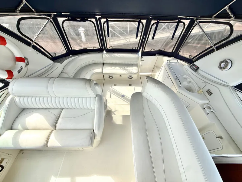 Slide: The Image of Interior of a 2003 Cruisers Yachts 3772 Express with white leather seating. - 10