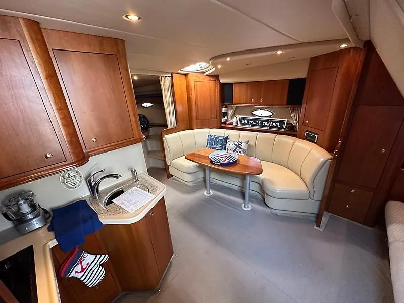 Slide: The Image of Interior of 2003 Cruisers Yachts 3772 Express with kitchen and seating area. - 15