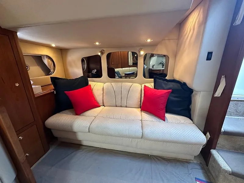 Slide: The Image of Interior of 2003 Cruisers Yachts 3772 Express with sofa and cushions. - 17