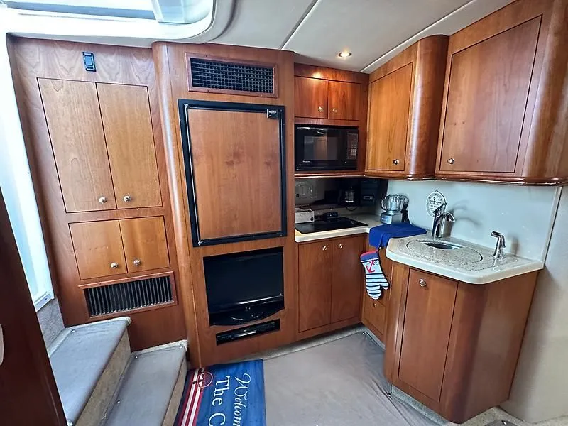 Slide: The Image of Interior of 2003 Cruisers Yachts 3772 Express with kitchen. - 18