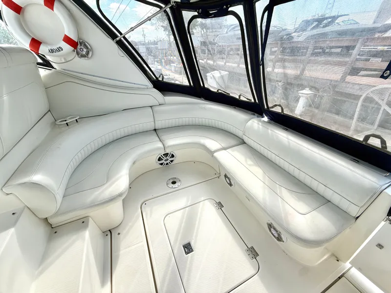 Slide: The Image of Interior of 2003 Cruisers Yachts 3772 Express with white leather seating. - 2