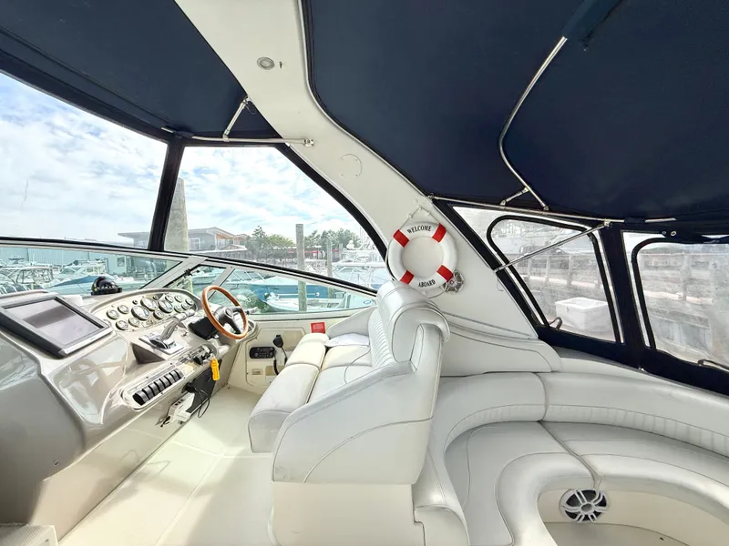 Slide: The Image of Interior of a 2003 Cruisers Yachts 3772 Express with luxurious cockpit. - 3