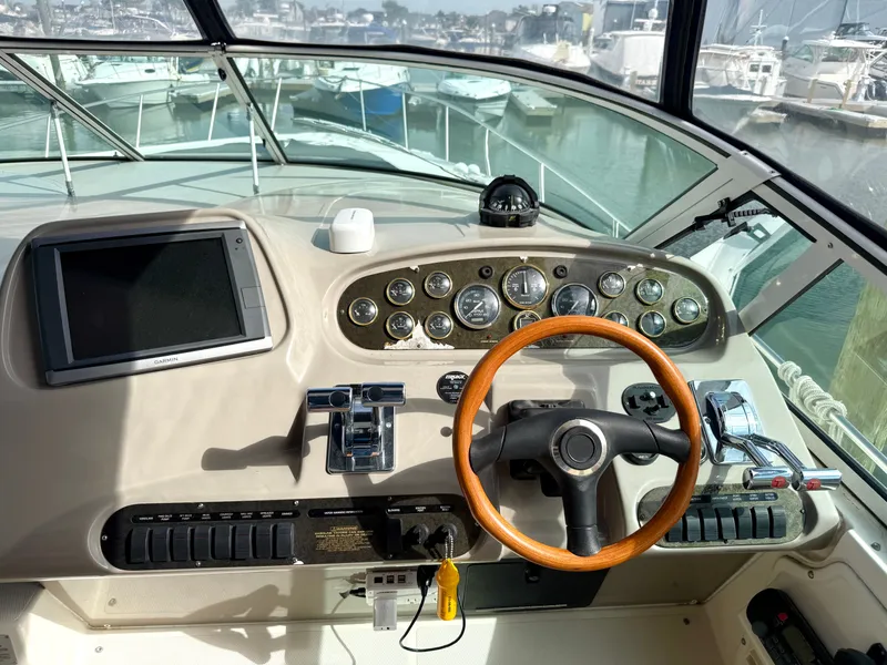 Slide: The Image of 2003 Cruisers Yachts 3772 Express helm with wooden steering wheel. - 7