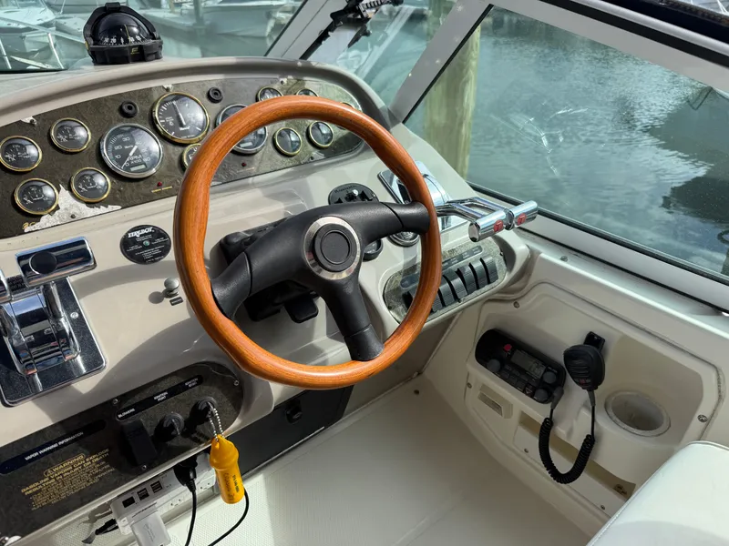 Slide: The Image of 2003 Cruisers Yachts 3772 Express helm with wooden steering wheel. - 8