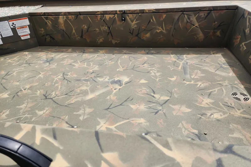 Slide: The Image of 2022 GRIZZLEY 1654SPT boat interior with camouflage pattern and storage compartment. - 4
