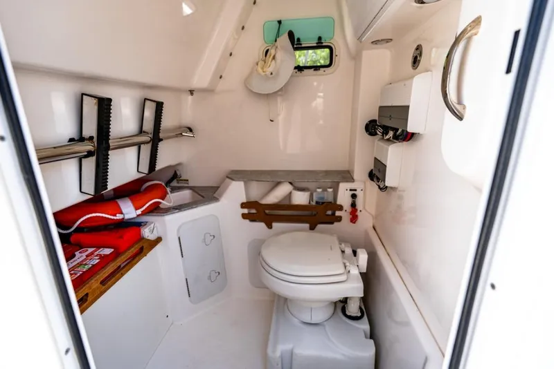 Slide: The Image of Luxury seating on 2021 Everglades 295 Center Console boat, featuring white quilted upholstery. - 11