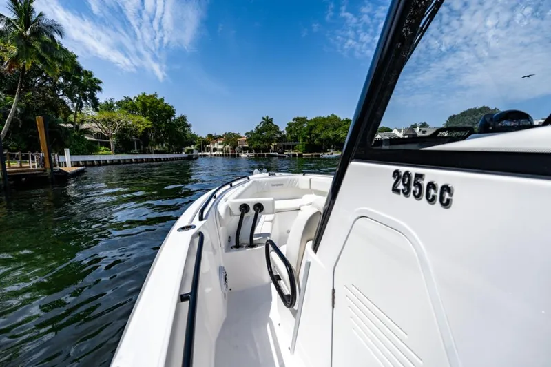 Slide: The Image of 2021 Everglades 295 Center Console boat cruising on a scenic waterway. - 14