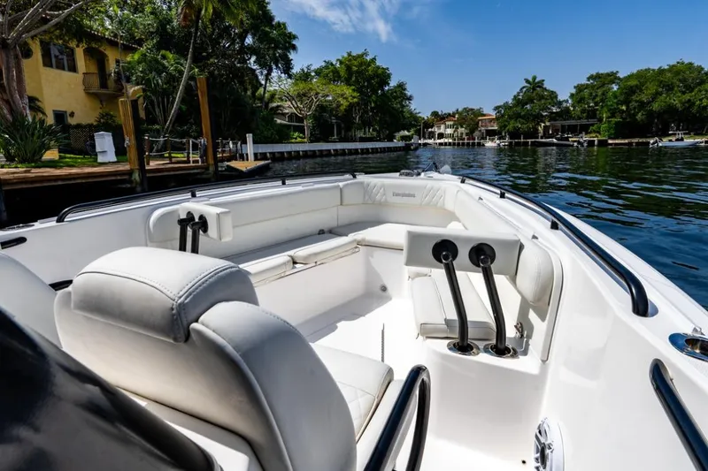 Slide: The Image of Interior view of 2021 Everglades 295 Center Console boat's control panel with electronic displays. - 16