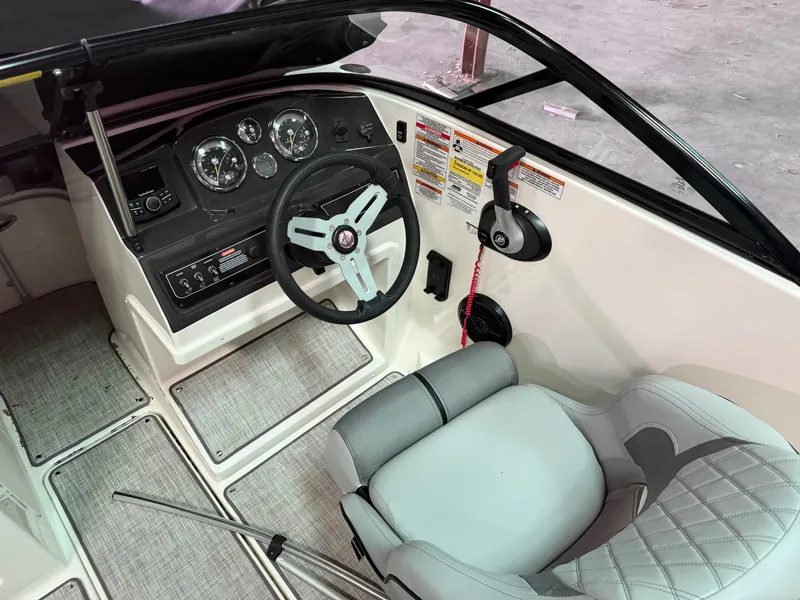 Slide: The Image of Interior of 2023 Bayliner VR4 BOWRIDER with steering console and seat. - 6