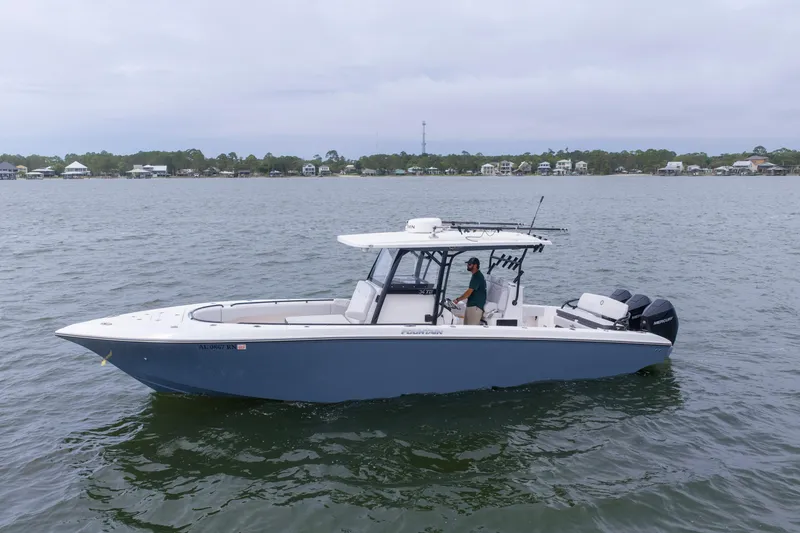 Slide: The Image of 2024 Fountain Bluewater 34 Tournament Edition boat on calm water. - 10