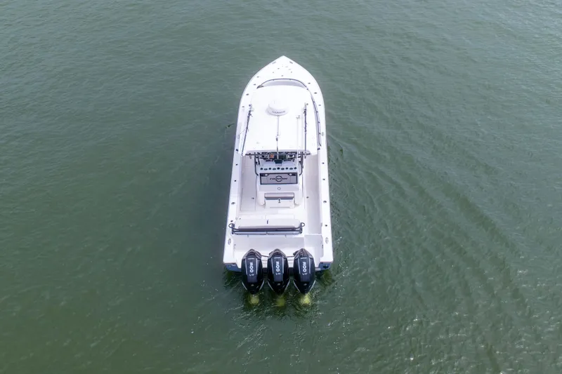 Slide: The Image of 2024 Fountain Bluewater 34 Tournament Edition boat on open water, aerial view. - 15
