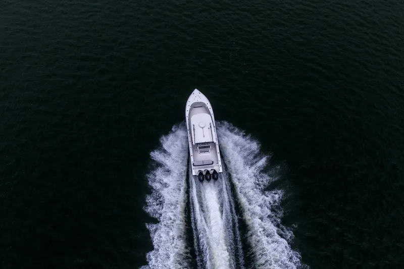 Slide: The Image of Aerial view of 2024 Fountain Bluewater 34 Tournament Edition speeding on open water. - 18