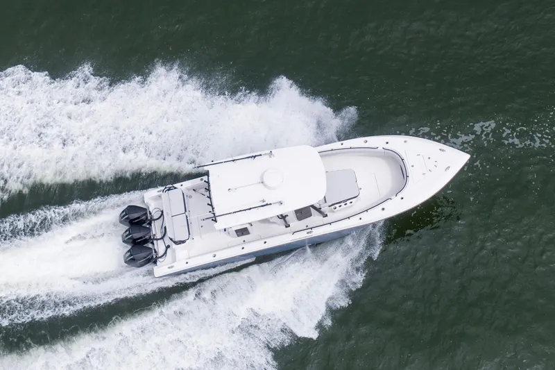 Slide: The Image of Aerial view of 2024 Fountain Bluewater 34 Tournament Edition boat speeding on water. - 3
