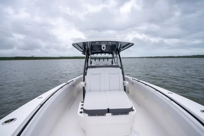 Slide: The Image of 2024 Fountain Bluewater 34 Tournament Edition boat on open water under cloudy sky. - 31