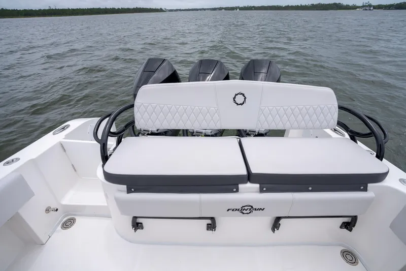 Slide: The Image of 2024 Fountain Bluewater 34 Tournament Edition boat with triple engines on open water. - 33