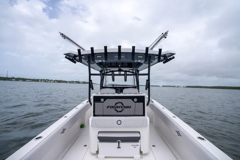 Slide: The Image of 2024 Fountain Bluewater 34 Tournament Edition boat on open water under cloudy sky. - 34