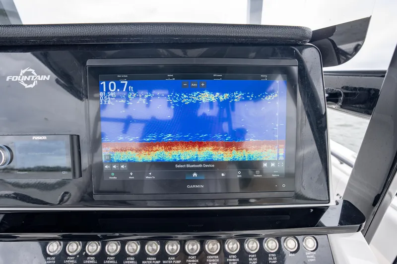 Slide: The Image of 2024 Fountain Bluewater 34 Tournament Edition dashboard with Garmin fishfinder display. - 41