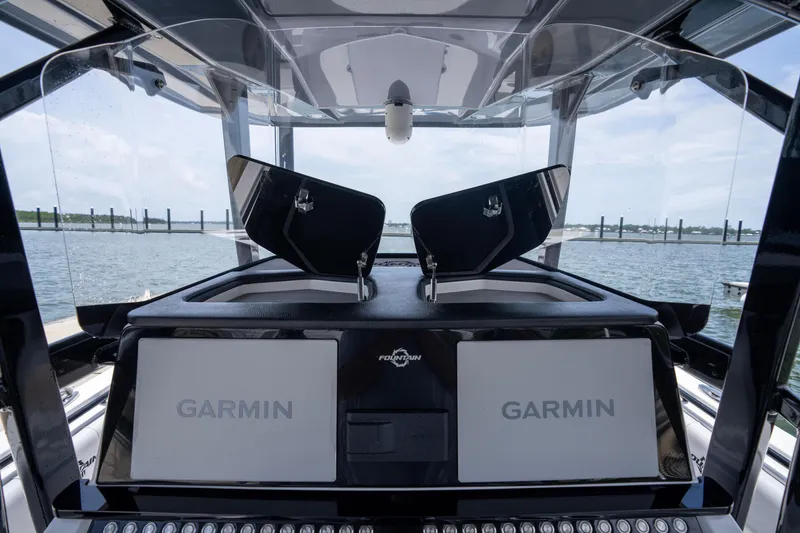 Slide: The Image of 2024 Fountain Bluewater 34 Tournament Edition boat with Garmin navigation displays. - 52