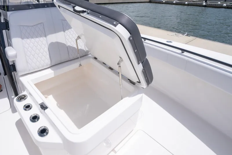 Slide: The Image of Open storage compartment on 2024 Fountain Bluewater 34 Tournament Edition boat. - 54