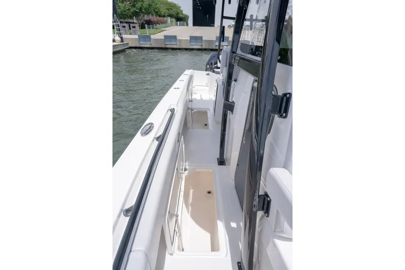 Slide: The Image of 2024 Fountain Bluewater 34 Tournament Edition boat interior with open storage compartment. - 56