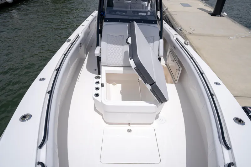 Slide: The Image of 2024 Fountain Bluewater 34 Tournament Edition boat interior with open storage compartment. - 58