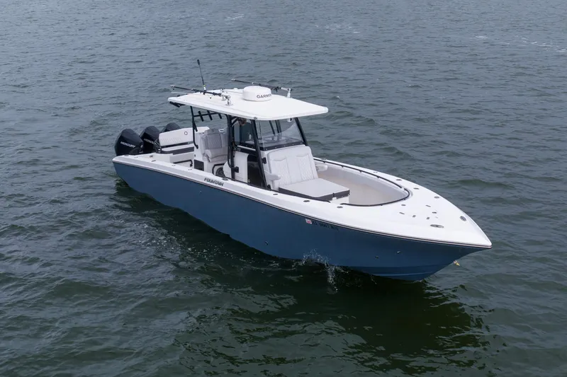 Slide: The Image of 2024 Fountain Bluewater 34 Tournament Edition boat cruising on open water. - 7