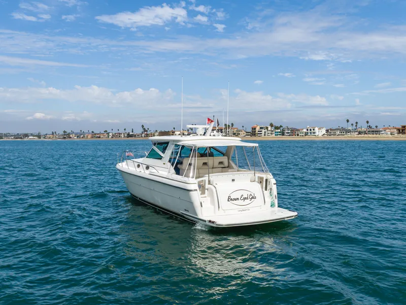 Slide: The Image of 2004 Tiara Yachts 4000 on open sea near coastline. - 1
