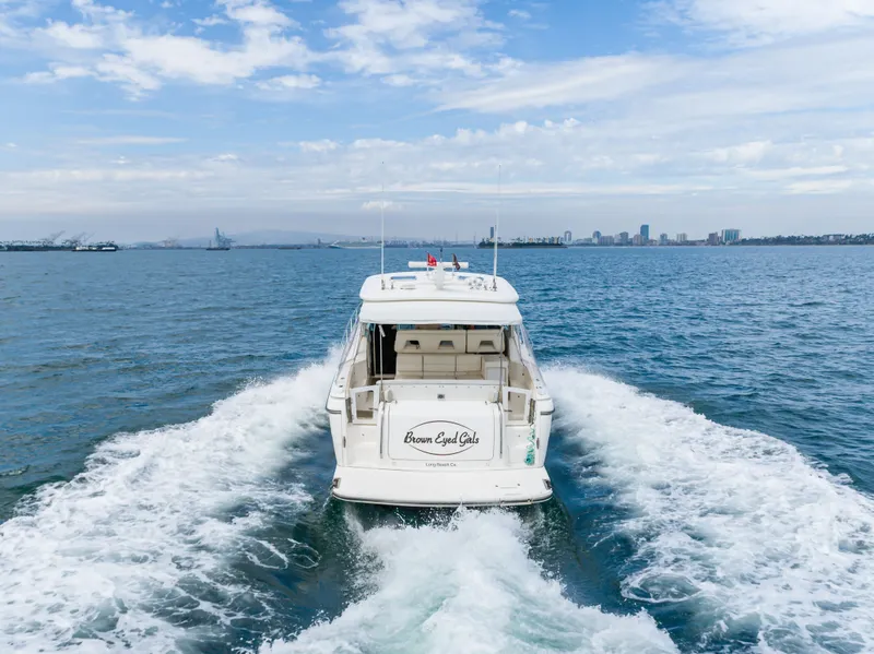 Slide: The Image of 2004 Tiara Yachts 4000 cruising on open water, rear view. - 18