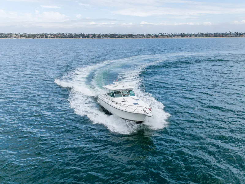 Slide: The Image of 2004 Tiara Yachts 4000 cruising swiftly on open sea. - 20