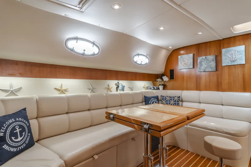Slide: The Image of Interior of a 2004 Tiara Yachts 4000 with elegant leather seating. - 48