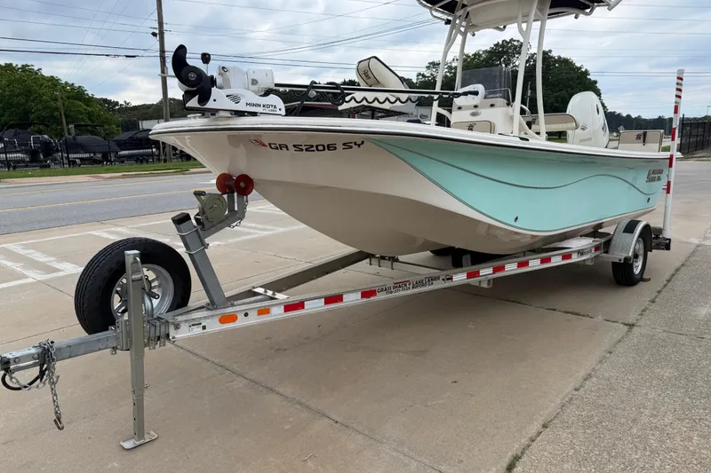 Slide: The Image of 2020 Carolina Skiff 21 LS boat on trailer, parked outdoors. - 30