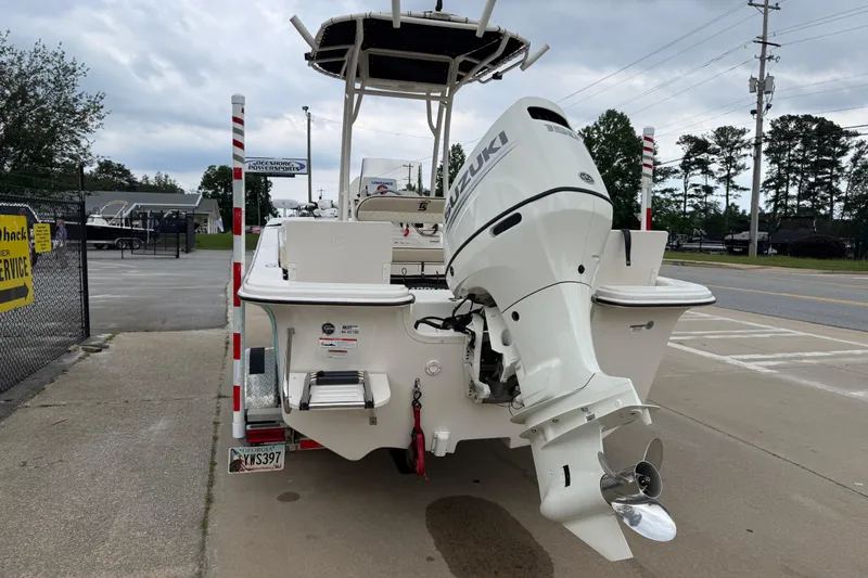 Slide: The Image of 2020 Carolina Skiff 21 LS boat with Suzuki outboard motor, parked outdoors. - 31