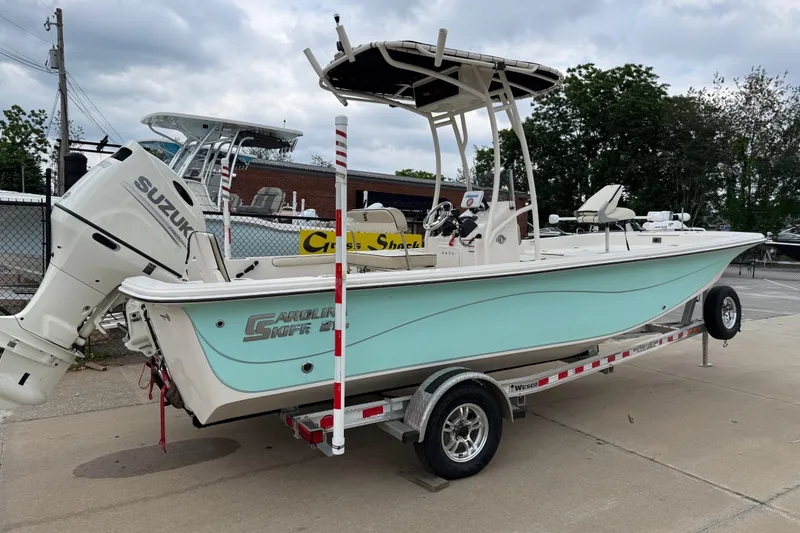 Slide: The Image of 2020 Carolina Skiff 21 LS boat on trailer with Suzuki outboard motor. - 33
