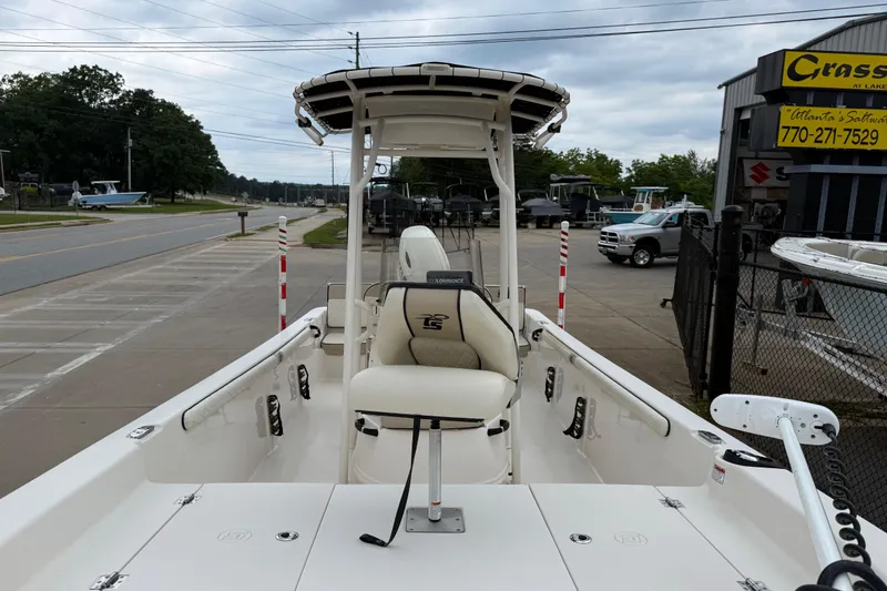 Slide: The Image of 2020 Carolina Skiff 21 LS boat at dealership, featuring center console and seating. - 34